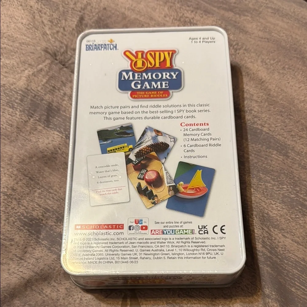 Scholastic brand I Spy Memory Game Tin. New in box. The game of picture riddles!